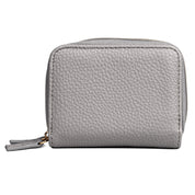 Grey wallet in front of white background with gold metal 