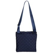 Navy blue quilted crossbody bag on a white background